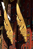 Wat Xieng Thong temple in Luang Prabang, Laos.  La Chapelle Rouge , the Red Chapel. Details of the consoles of the roof. 